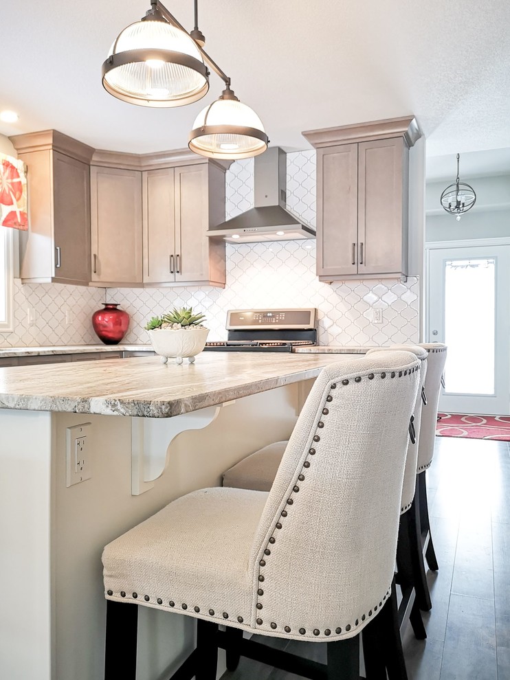 Inspiration for a mid-sized transitional l-shaped medium tone wood floor and brown floor open concept kitchen remodel in Toronto with an undermount sink, shaker cabinets, light wood cabinets, granite countertops, white backsplash, porcelain backsplash, stainless steel appliances, an island and beige countertops