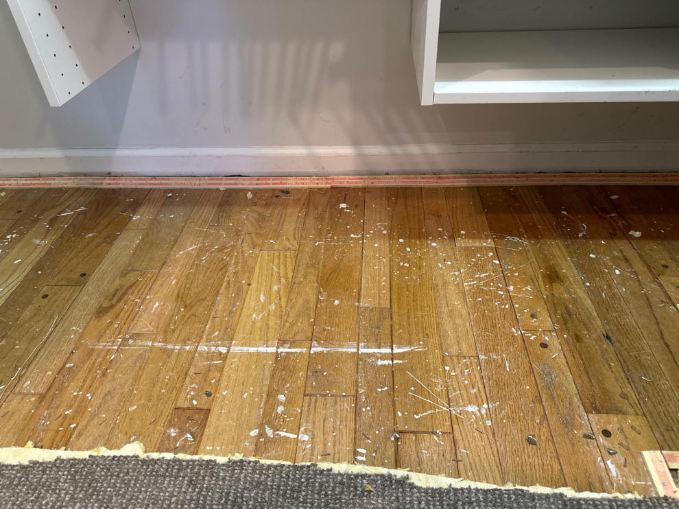 ripped up carpet to find hardwood but so much paint!
