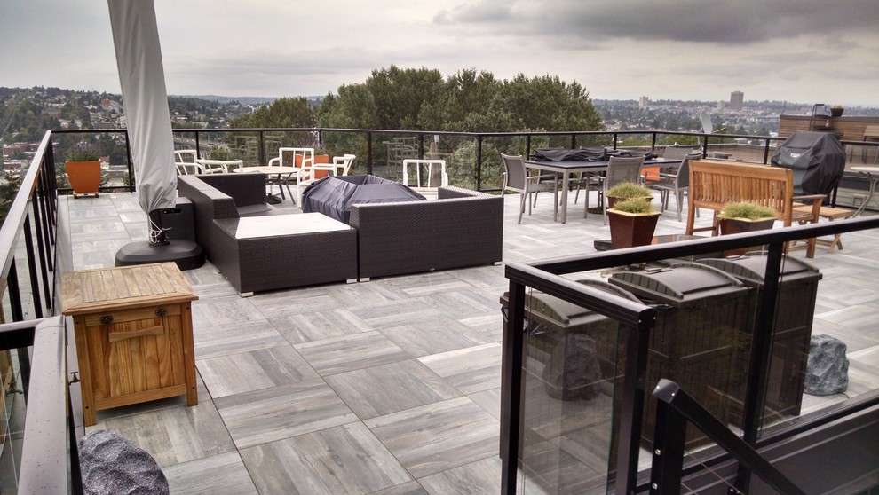 This is an example of a mid-sized contemporary patio in Seattle with decking.