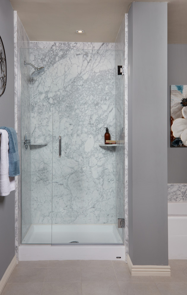 Photo of a large transitional master bathroom in San Diego with an alcove tub, a corner shower, gray tile, stone slab, grey walls, porcelain floors, beige floor and a hinged shower door.
