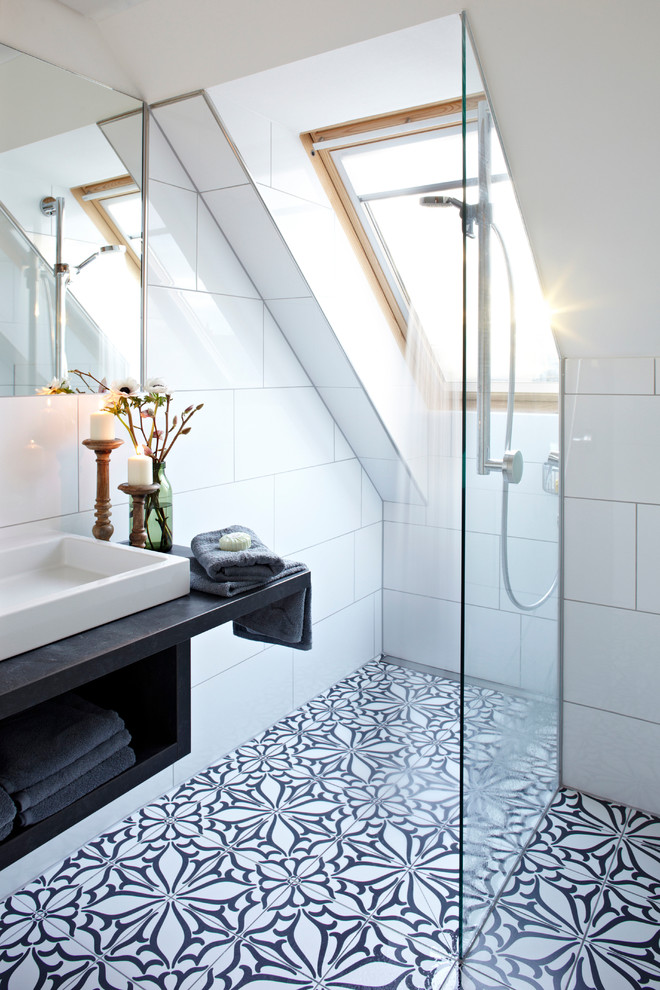 Inspiration for a small contemporary bathroom in Munich with open cabinets, white tile, ceramic tile, ceramic floors, a vessel sink, white walls, wood benchtops and black benchtops.