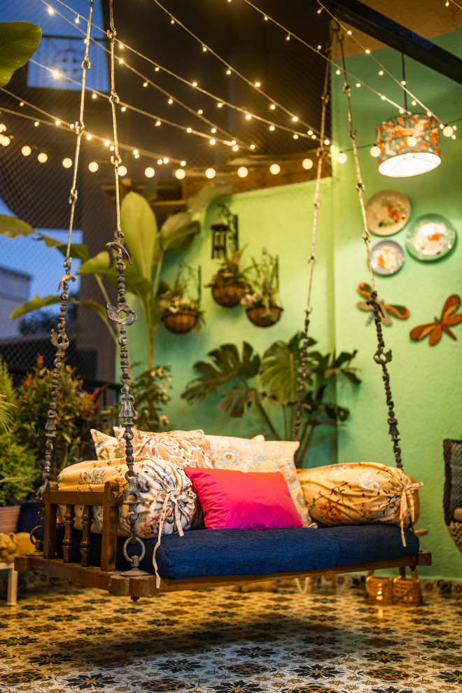 This is an example of an eclectic patio in Pune.