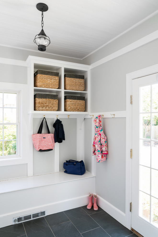 Inspiration for a small traditional mudroom in Philadelphia with grey walls, porcelain floors, a single front door, a white front door, grey floor, wood and decorative wall panelling.