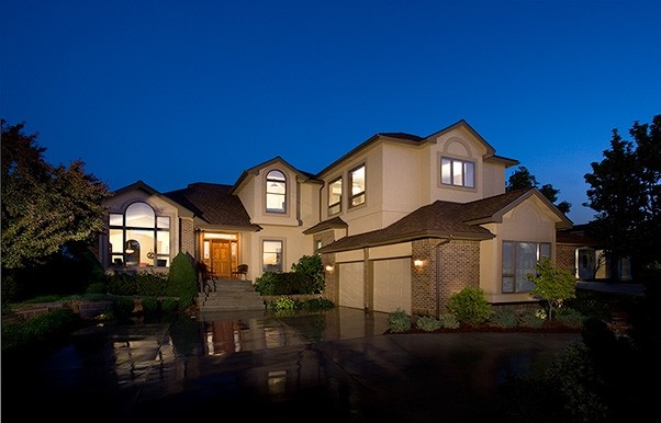 This is an example of a mid-sized traditional two-storey stucco beige exterior in Boise with a gable roof.