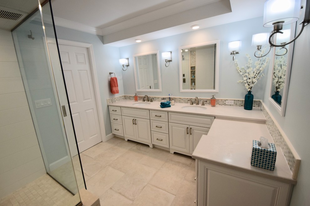 Large transitional master bathroom in Other with raised-panel cabinets, white cabinets, an open shower, a two-piece toilet, beige tile, ceramic tile, blue walls, ceramic floors, an undermount sink, engineered quartz benchtops, beige floor, an open shower and beige benchtops.