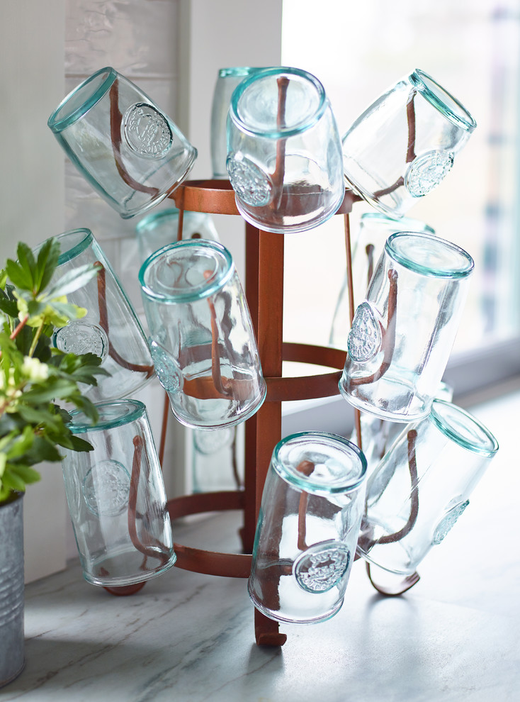 Inspiration for a mid-sized transitional l-shaped slate floor and gray floor enclosed kitchen remodel in Boston with a farmhouse sink, shaker cabinets, blue cabinets, quartzite countertops, white backsplash, subway tile backsplash, stainless steel appliances, an island and white countertops