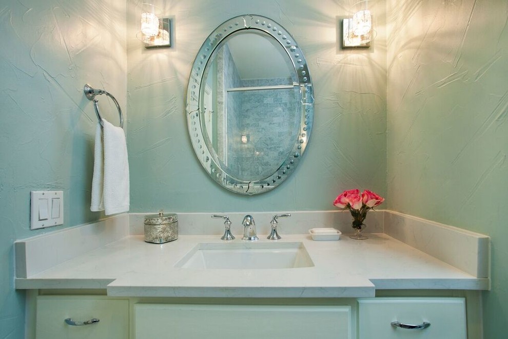Example of a mid-sized transitional kids' gray tile and stone tile marble floor corner shower design in Dallas with raised-panel cabinets, white cabinets, a two-piece toilet, blue walls, an undermount sink and solid surface countertops