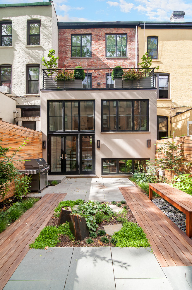 Contemporary backyard patio in New York with no cover.