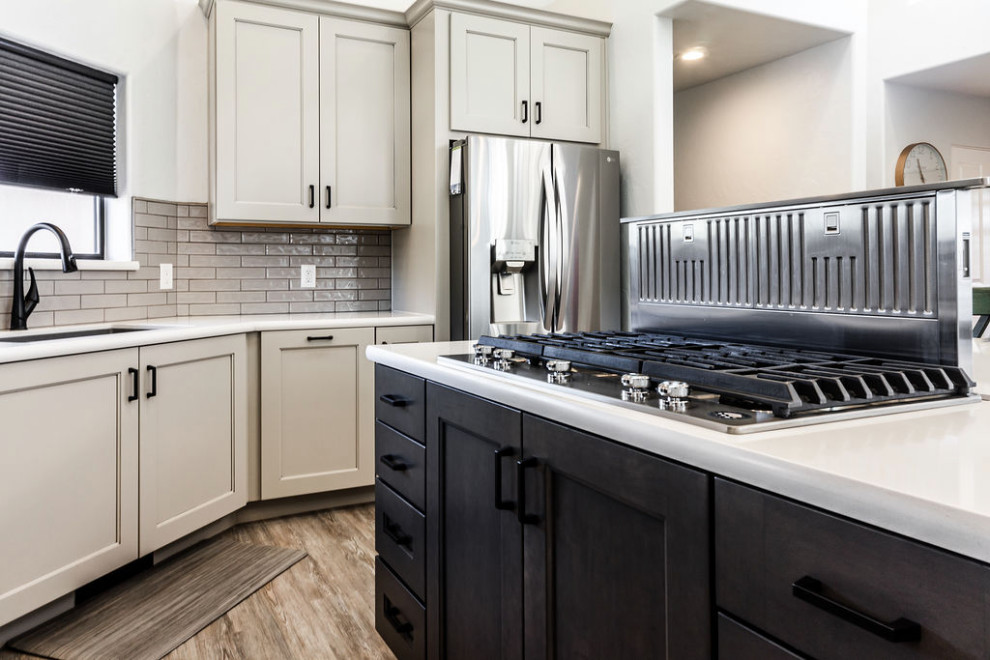 Inspiration for a large transitional u-shaped vinyl floor and gray floor eat-in kitchen remodel with an undermount sink, shaker cabinets, gray cabinets, quartzite countertops, green backsplash, subway tile backsplash, stainless steel appliances, an island and white countertops