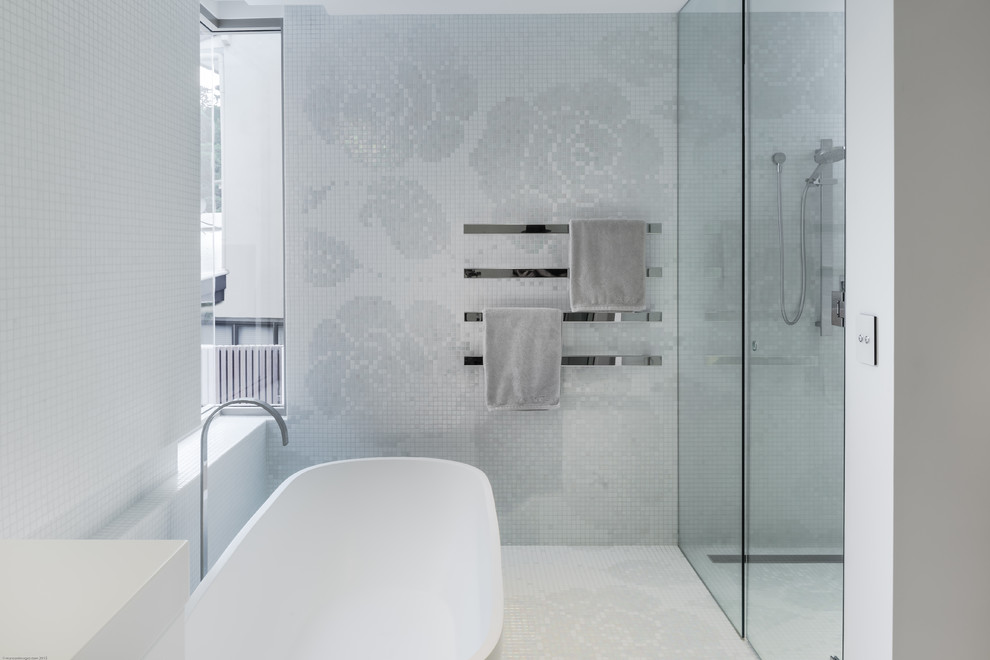 This is an example of a contemporary bathroom in Sunshine Coast with a freestanding tub, white tile, mosaic tile and mosaic tile floors.