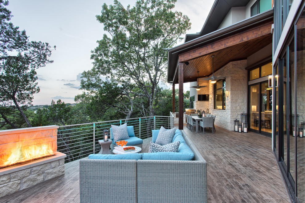 This is an example of a country deck in Austin with a fire feature.