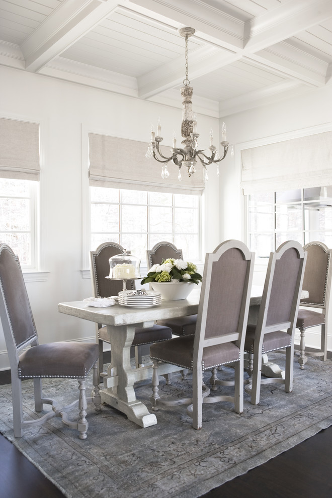 Photo of a large separate dining room in Other with white walls and dark hardwood floors.