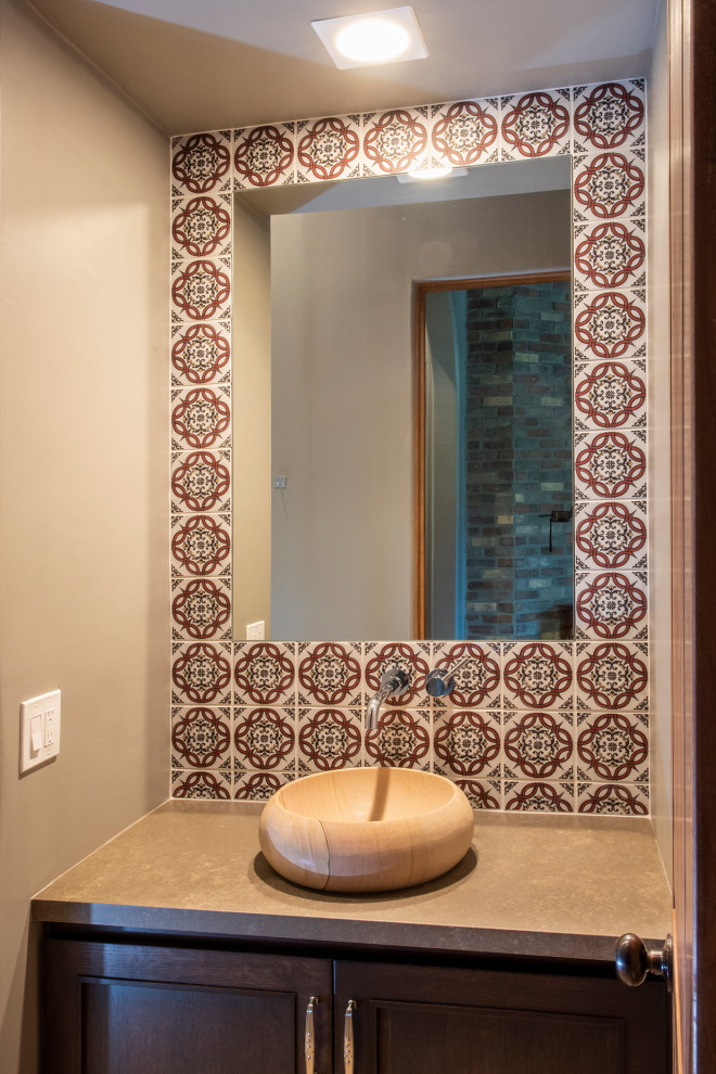 Photo of a large arts and crafts 3/4 bathroom in Phoenix with shaker cabinets, medium wood cabinets, an alcove shower, a one-piece toilet, red tile, mosaic tile, travertine floors, a vessel sink, quartzite benchtops, beige floor, brown benchtops, a single vanity and a built-in vanity.