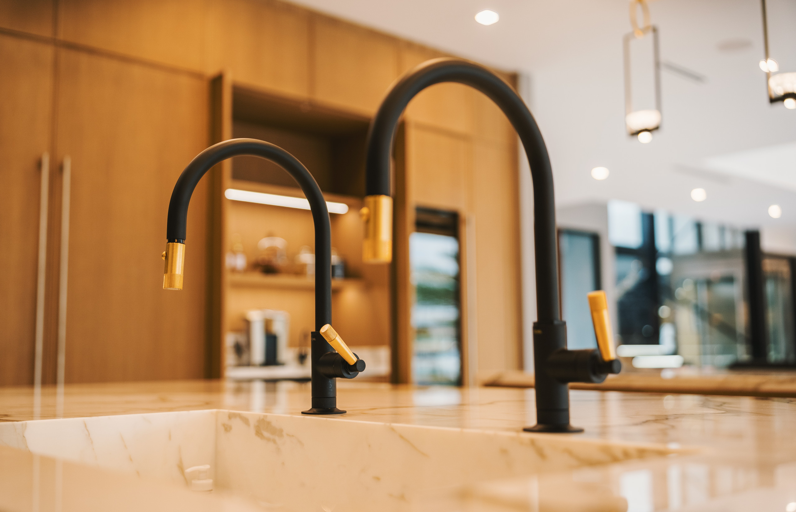 Functional Elegance: Close-Up of Double Faucet on Working Island