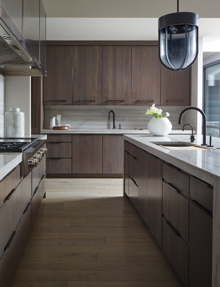 Inspiration for a contemporary eat-in kitchen in Chicago with flat-panel cabinets, brown cabinets, quartzite benchtops, grey splashback, stone slab splashback, coloured appliances, light hardwood floors, with island, grey floor and grey benchtop.