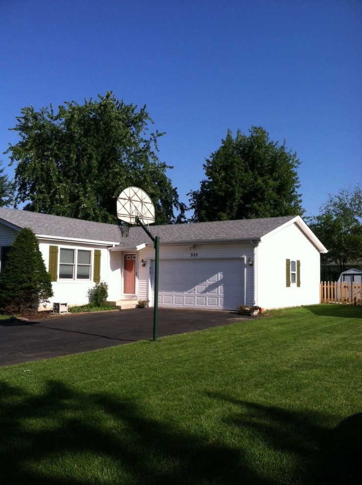 White ranch, green shutters, orange door