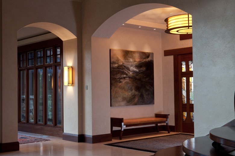 This is an example of a large contemporary foyer in Salt Lake City with beige walls, a single front door and a dark wood front door.