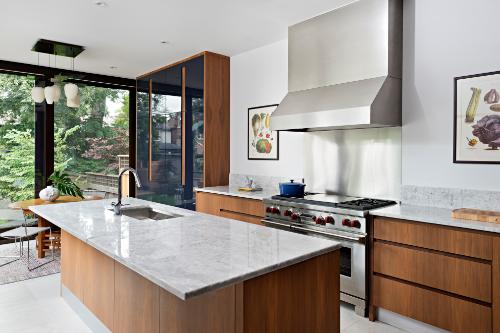 Inspiration for a contemporary l-shaped kitchen in Toronto with an undermount sink, open cabinets, blue cabinets, panelled appliances, with island and multi-coloured benchtop.