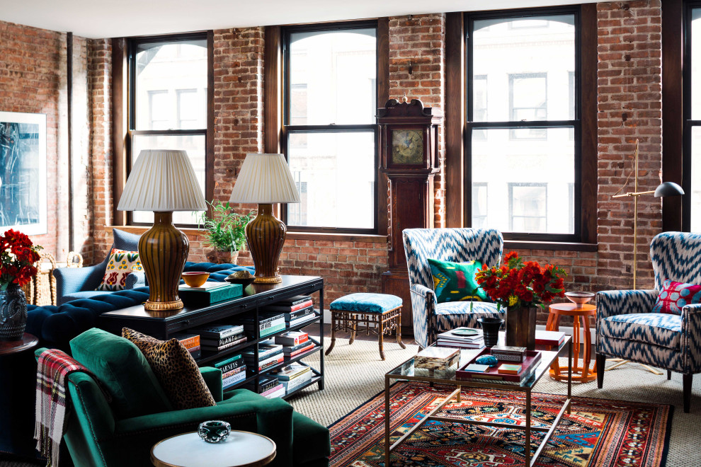 Traditional living room in Boston with red walls, dark hardwood floors, brown floor and brick walls.