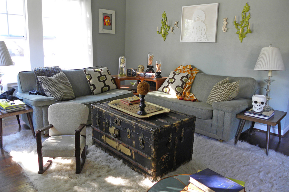 Photo of an eclectic living room in Dallas with grey walls and dark hardwood floors.