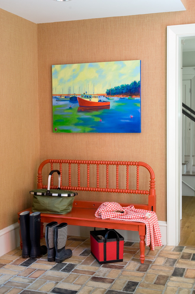 Design ideas for a traditional entryway in Portland Maine with orange walls.