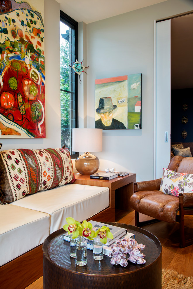 Small eclectic open concept living room in Sydney with grey walls, medium hardwood floors, no fireplace and no tv.
