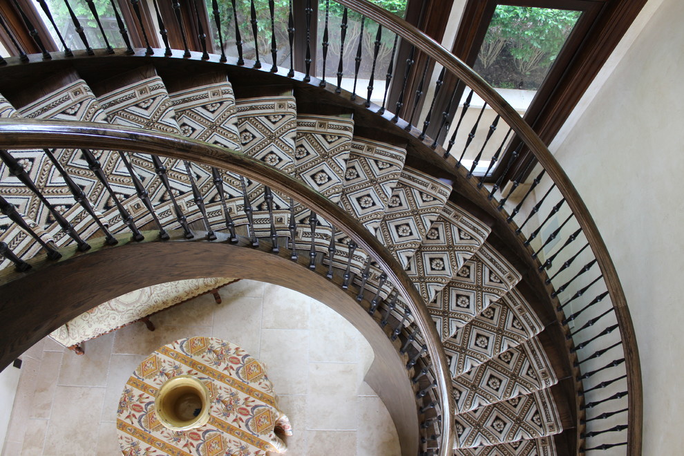 Expansive mediterranean carpeted straight staircase in New York with carpet risers and wood railing.