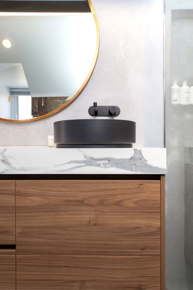 Design ideas for a mid-sized contemporary 3/4 bathroom in Melbourne with light wood cabinets and laminate benchtops.