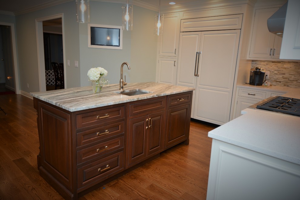 Large transitional l-shaped dark wood floor eat-in kitchen photo in Boston with raised-panel cabinets, white cabinets, granite countertops, multicolored backsplash, ceramic backsplash, stainless steel appliances, an island and a farmhouse sink