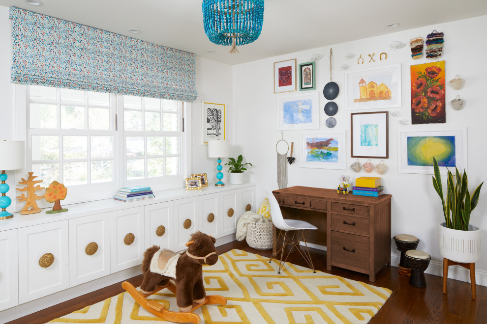 Study space transitional dark wood floor and brown floor kids' study room photo in Los Angeles with white walls