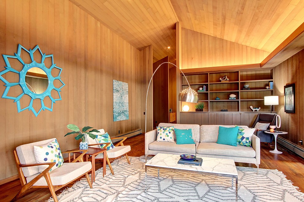 Photo of a large midcentury formal living room in Seattle with brown walls and medium hardwood floors.
