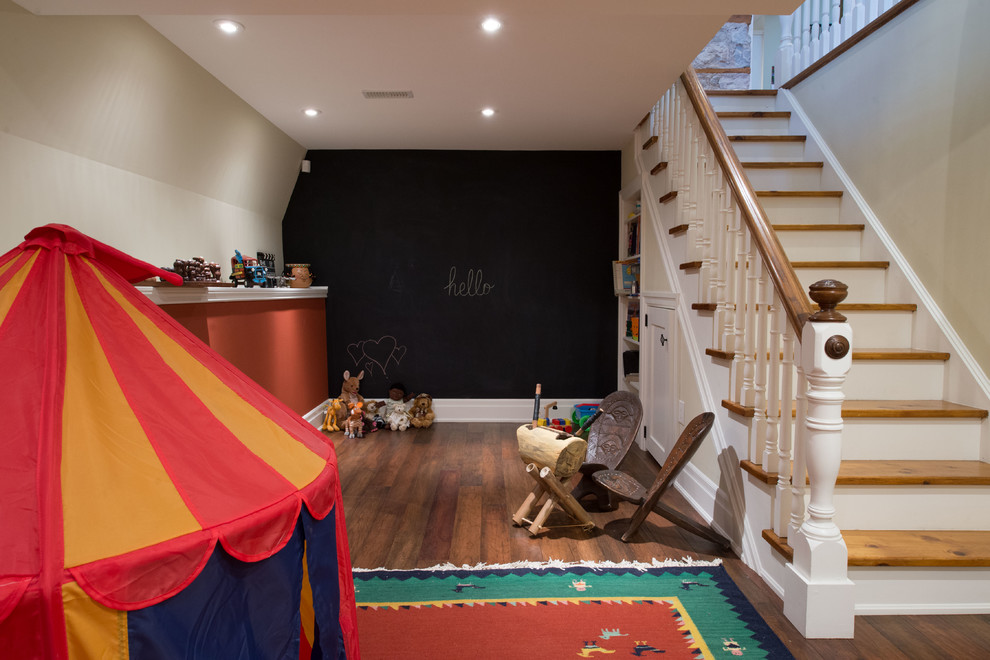 Mid-sized eclectic fully buried basement in Toronto with beige walls, laminate floors and no fireplace.