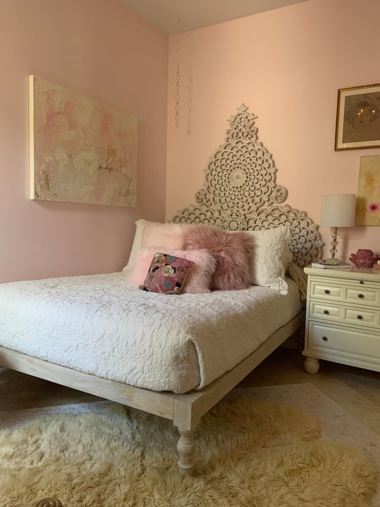 Design ideas for a small eclectic bedroom in Miami with pink walls, travertine floors and beige floor.