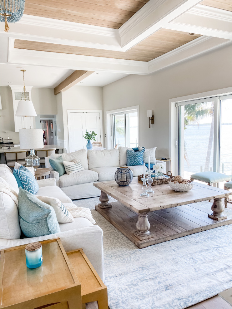 Photo of a large beach style open concept living room in Orlando with grey walls and coffered.