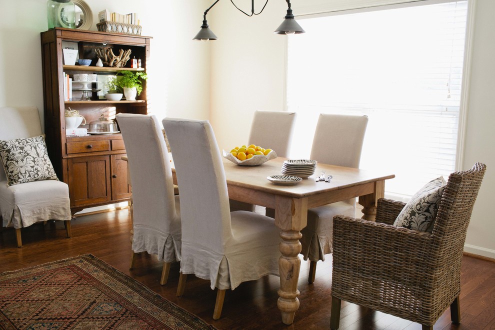 Country dining room in Birmingham with white walls and dark hardwood floors.