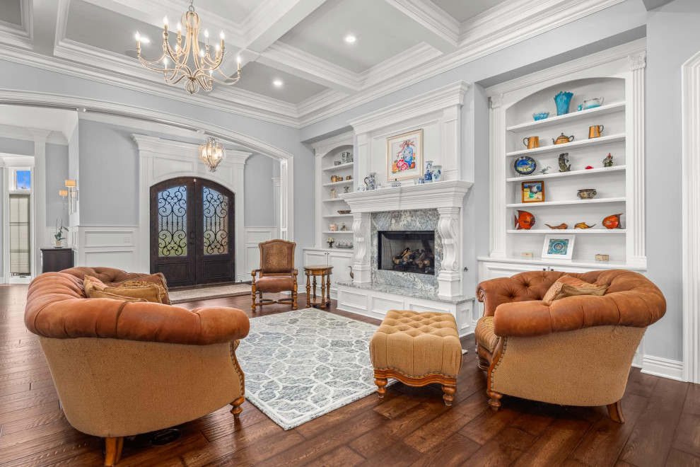 Design ideas for a large traditional formal open concept living room in Other with grey walls, dark hardwood floors, a standard fireplace, a stone fireplace surround, brown floor, coffered and decorative wall panelling.