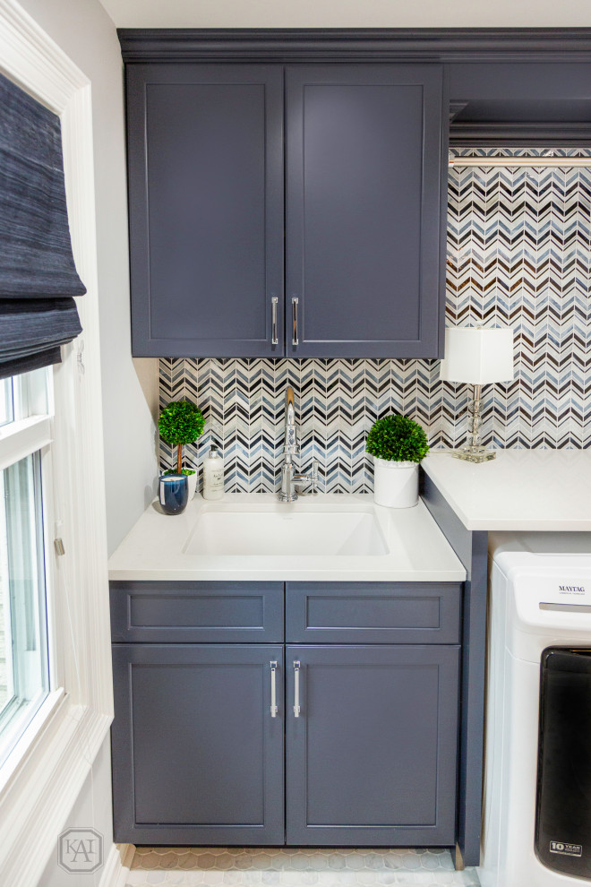 Example of a small transitional marble floor and multicolored floor laundry room design in Chicago with an undermount sink, recessed-panel cabinets, blue cabinets, quartz countertops, multicolored backsplash, mosaic tile backsplash, gray walls, a side-by-side washer/dryer and white countertops