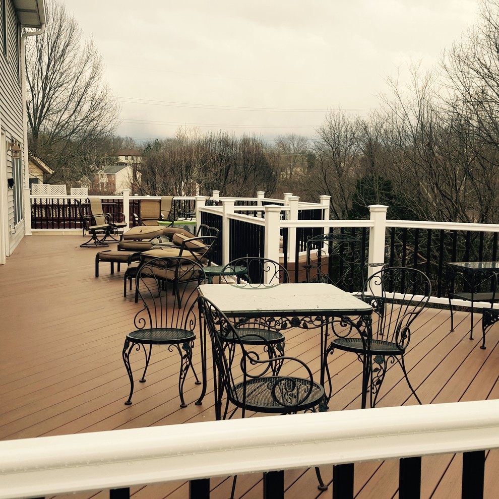 This is an example of a large arts and crafts backyard deck in St Louis with no cover.