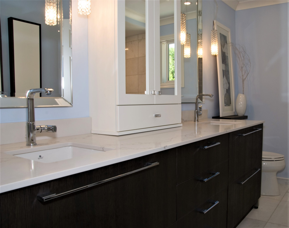 Inspiration for a mid-sized transitional blue tile and ceramic tile ceramic tile, white floor and double-sink alcove bathtub remodel with recessed-panel cabinets, dark wood cabinets, a two-piece toilet, blue walls, an undermount sink, quartz countertops, a hinged shower door, white countertops and a built-in vanity