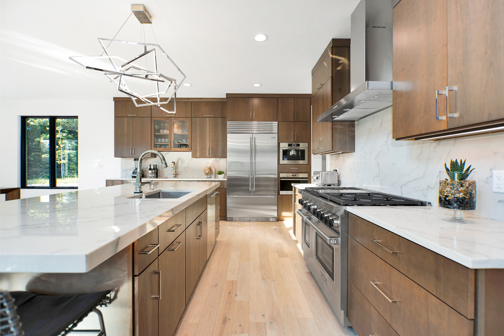 This is an example of a large modern kitchen in Miami.