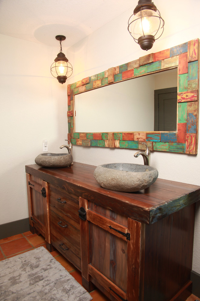 Mid-sized eclectic 3/4 bathroom in Toronto with furniture-like cabinets, distressed cabinets, wood benchtops, mosaic tile floors and orange floor.