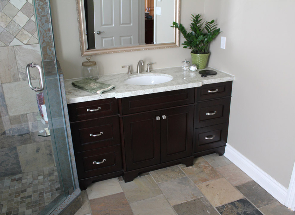 Inspiration for a mid-sized traditional master bathroom in Toronto with recessed-panel cabinets, dark wood cabinets, beige walls, granite benchtops, slate floors and an undermount sink.