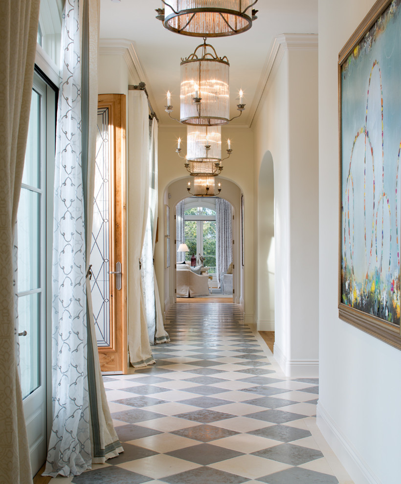 Inspiration for a large mediterranean hallway in San Diego with white walls and multi-coloured floor.