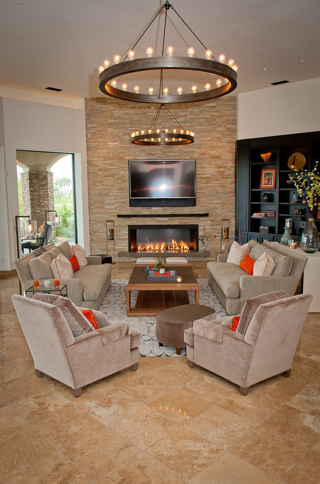 This is an example of a mid-sized transitional open concept family room in Phoenix with white walls, travertine floors, a ribbon fireplace, a stone fireplace surround and a wall-mounted tv.