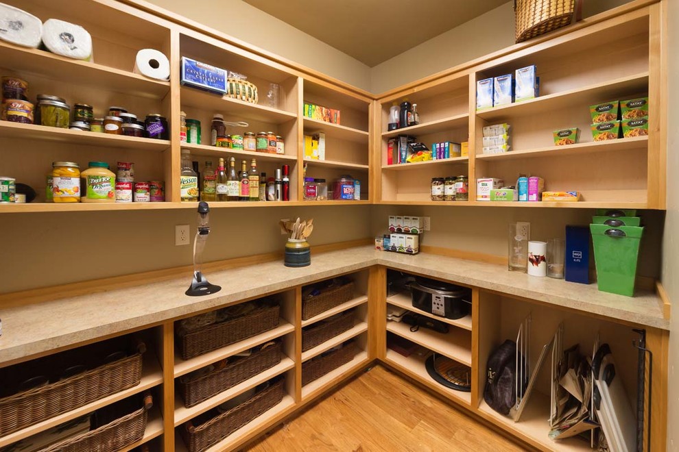 Example of a mid-sized mountain style medium tone wood floor and brown floor kitchen pantry design with open cabinets and medium tone wood cabinets