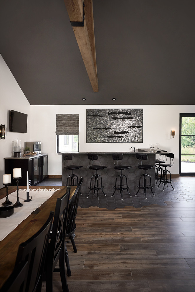 Inspiration for an expansive country wet bar in Grand Rapids with an integrated sink, black cabinets, granite benchtops, black splashback, porcelain floors, black floor and black benchtop.