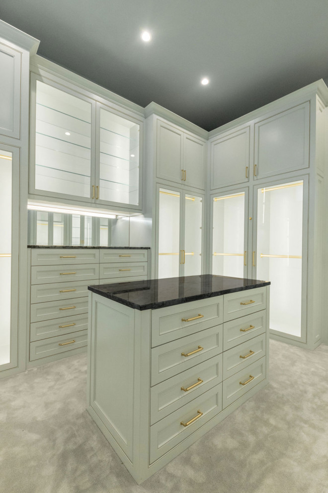 Large traditional gender neutral walk-in wardrobe in Dallas with beaded cabinets, grey cabinets, carpet and grey floors.