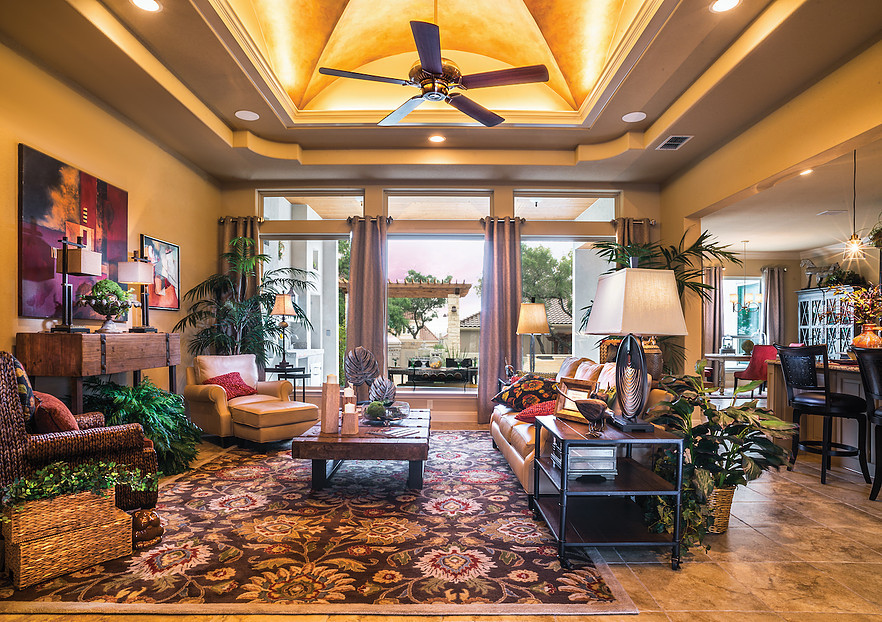 Photo of a mid-sized mediterranean formal open concept living room in Austin with beige walls, ceramic floors and no tv.