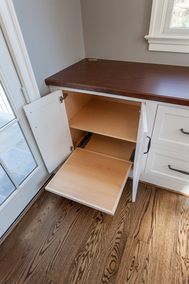 Example of a transitional freestanding desk medium tone wood floor and brown floor home design design in DC Metro with beige walls