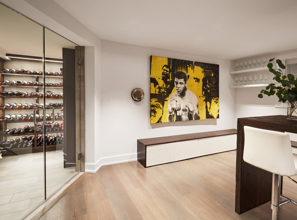 This is an example of a transitional wine cellar in Chicago with storage racks and beige floor.